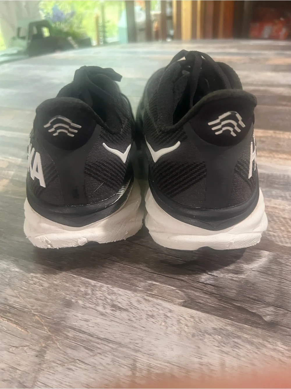 Men's size 11.5D Hoka Black and White Road Running Shoes